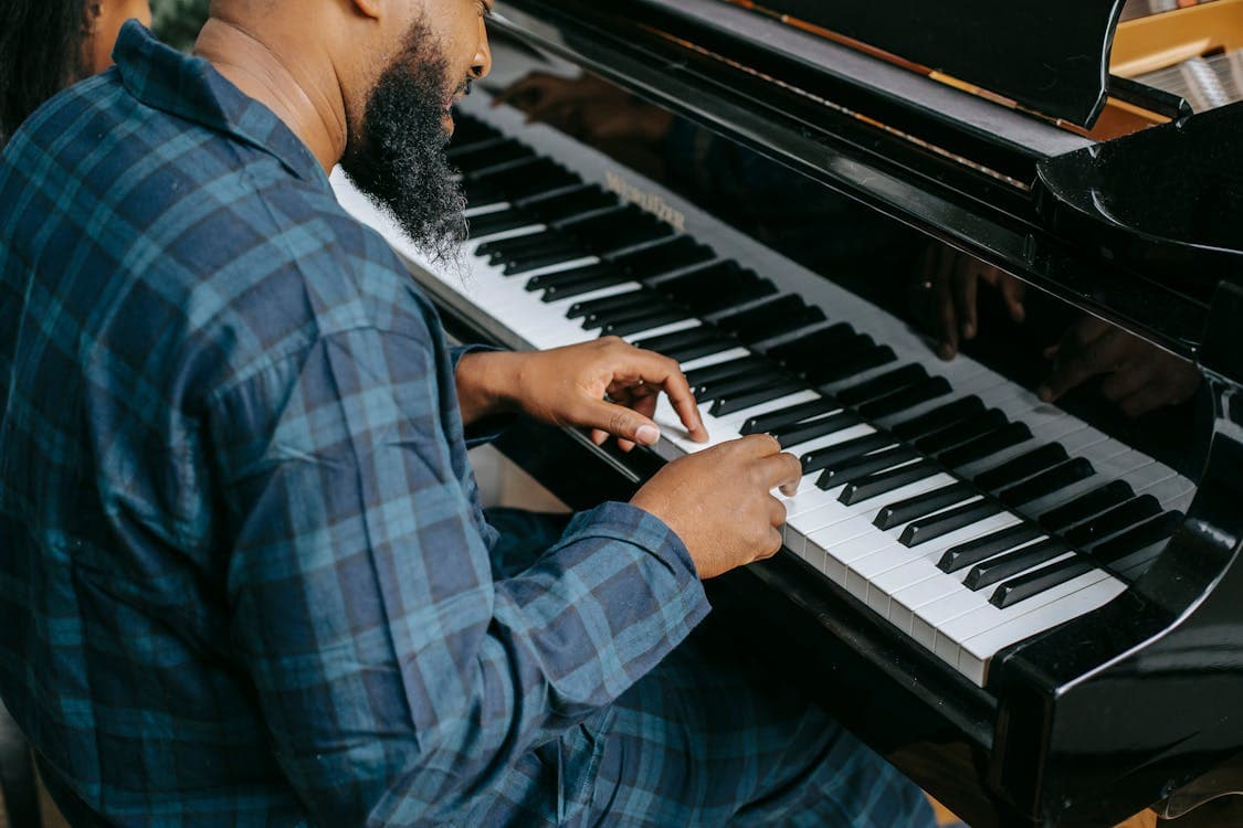 Musician playing piano at home